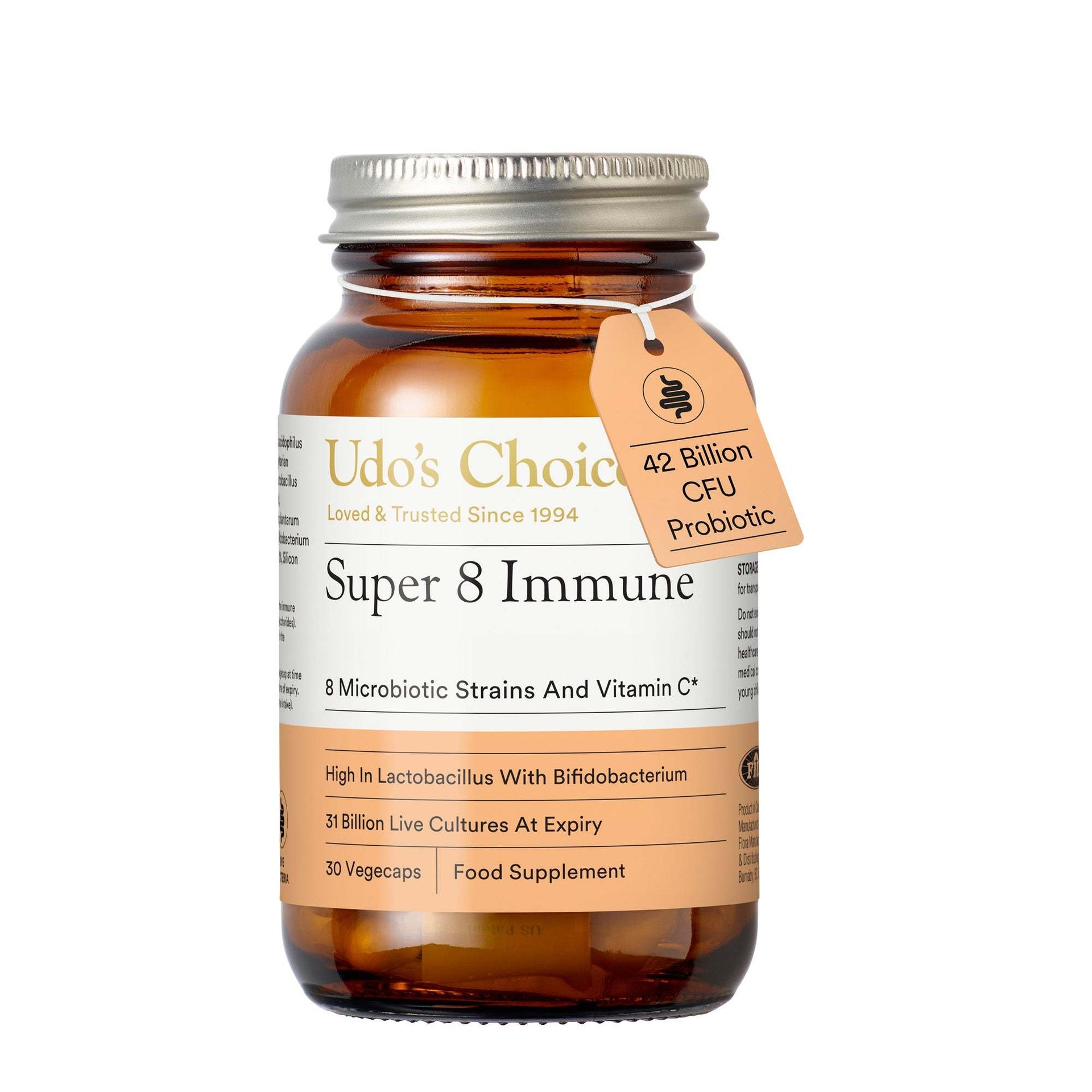 Udo's Choice Super 8 Immune food supplement in an amber glass bottle with a silver metal cap and a hanging peach-colored tag indicating 42 Billion CFU Probiotic.